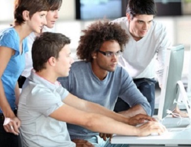 five students working together at a computer