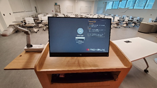 Classroom podium computer showing the login screen