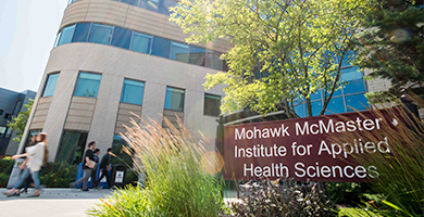 Students walking near the entrance to the Mohawk McMaster Institute for Applied Health Sciences