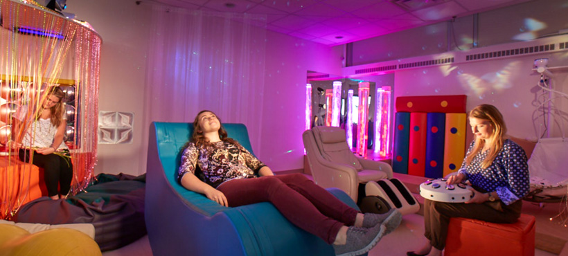 Student sitting in the multi-sensory lab.