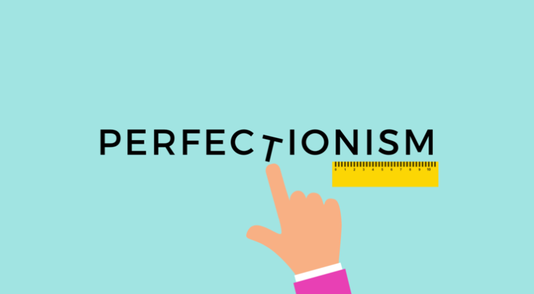 Finger pointing at the word perfectionism