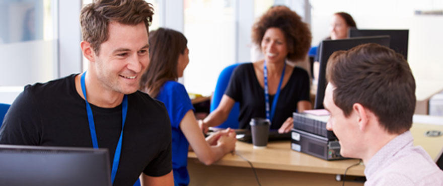 A student talking to an advisor in a student services office