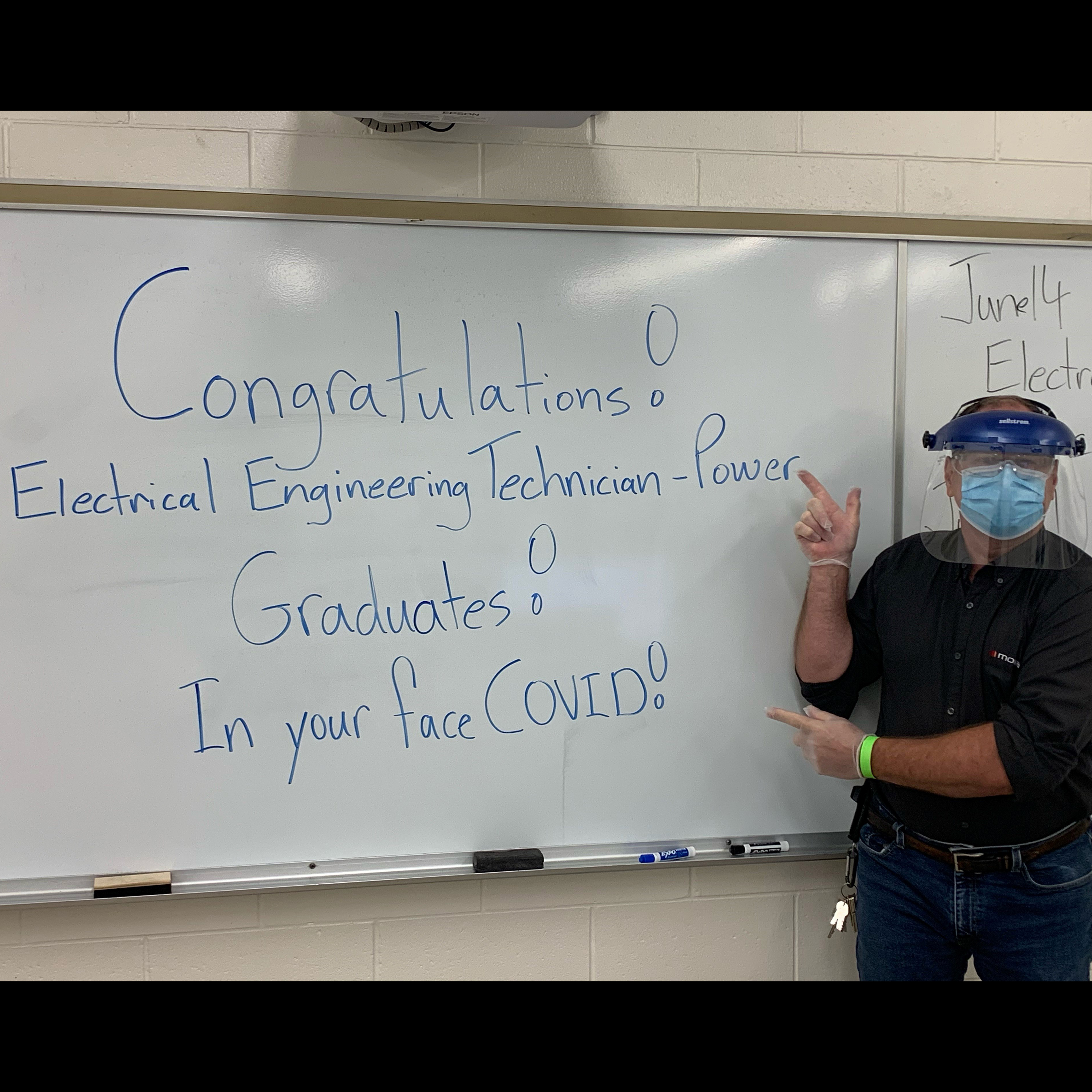 a man named Glenn Kinaschuk with a sign