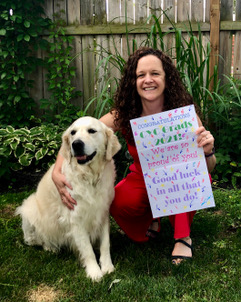 A lady named Julie Scheffel holding a sign