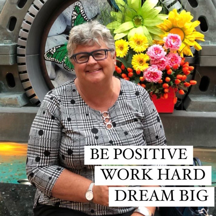 A lady named Linda Haslam-Stroud holding a sign
