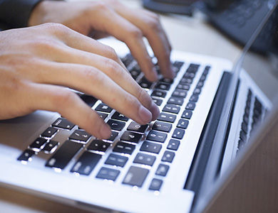 A computer sitting on a desk with some typing