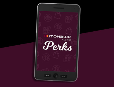 cellphone with Alumni Perks app on it