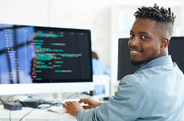 young man sitting at a computer