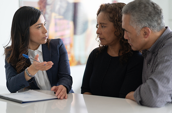 a financial advisor having a discussion with two people