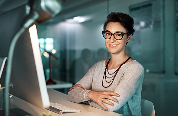 A professional woman at a computer