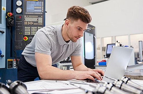 a person working in a CNC environment