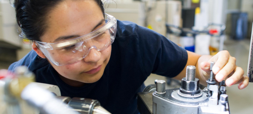 Female skilled trades student working