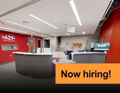 MSA front desk with banner overlay that says now hiring!