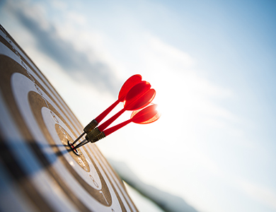 Three darts hitting the target