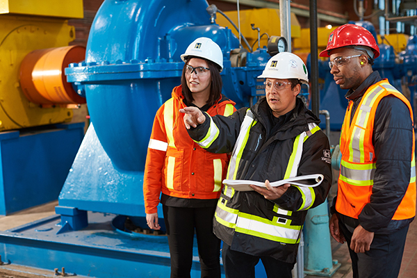 Students on the job at manufacturing plant