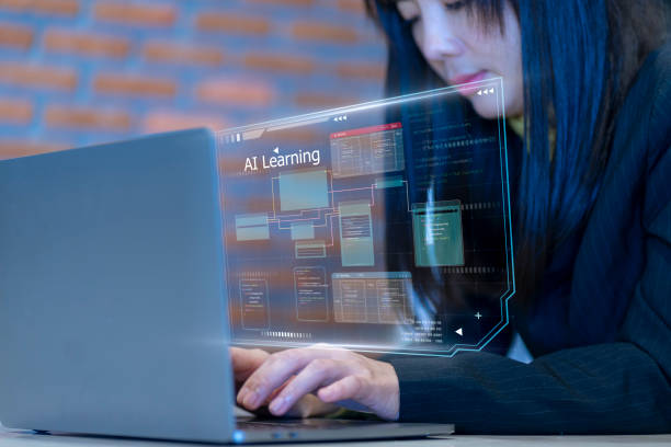 Female Asian student witth reflected computer monitor graphics.