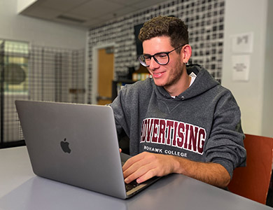 Student in front of a laptop