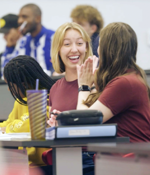 Two Mohawk College students smiling and working together