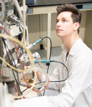 Mohawk College student working with equipment in a lab
