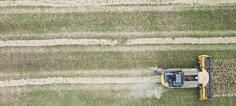 Tractor in green field