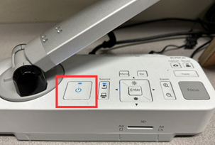 Photo showing the ELPDC21 control panel on the top of the base with the power button highlighted