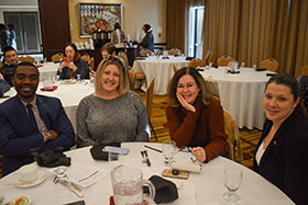 group of team members sitting at a table