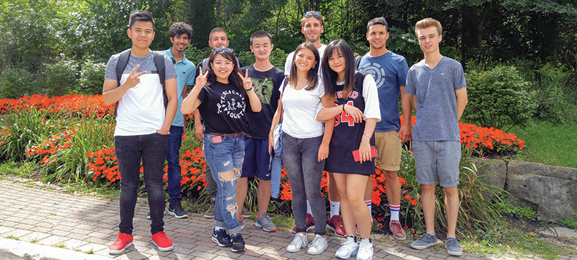 students standing in front of a park