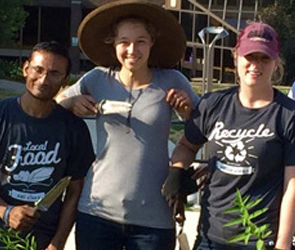 Sustainability team members posing in the community garden