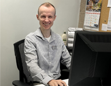 mohawk admissions representative sitting at their desk and smiling
