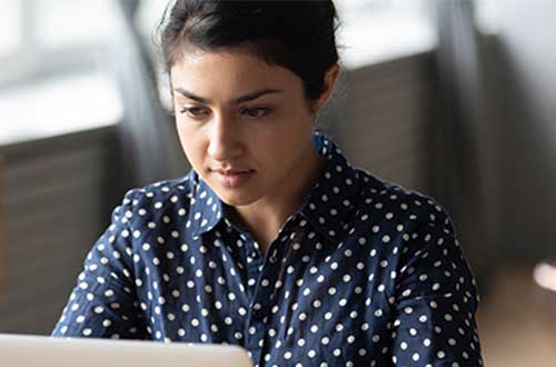 student on laptop studying