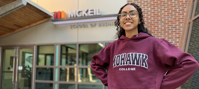 mohawk students outside the mckeil school of business building