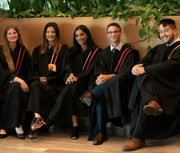 Group of Mohawk graduates in gowns