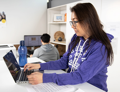 Mohawk College Student working on her laptop