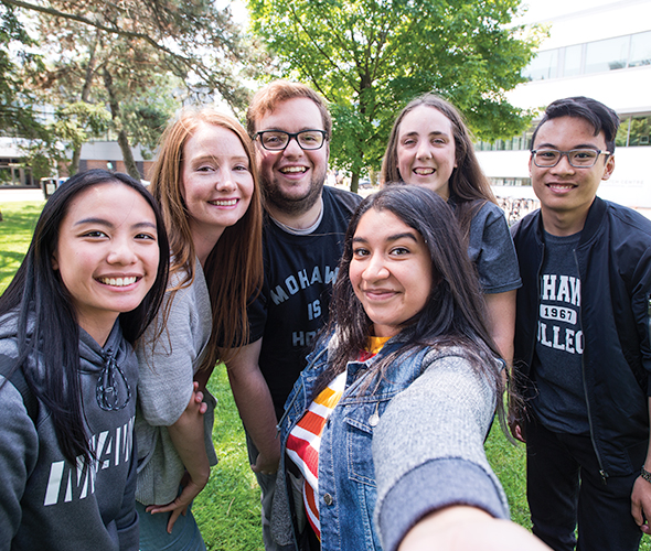 Group of students smiling for a selfie