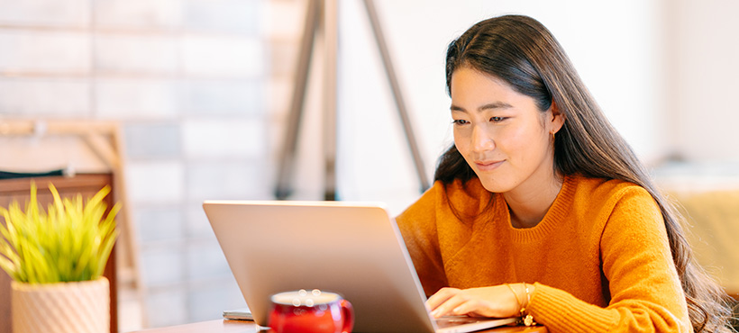 student studying with laptop