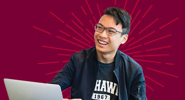 Mohawk student working on a laptop