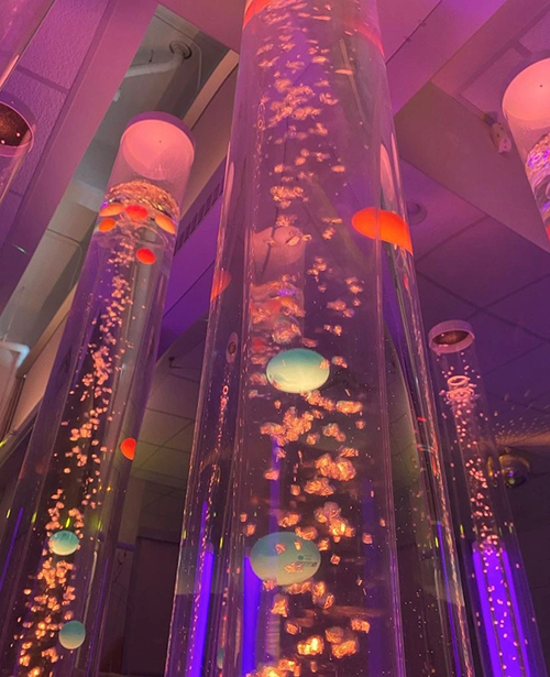 Towering tubes filled with bubbles and colourful lights
