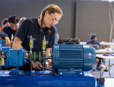 Mohawk College student competing at Skills Ontario competition on a lathe machine