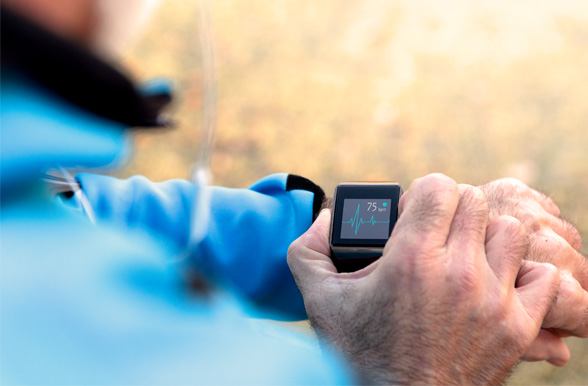 a man checking his heartbeat on his digital watch