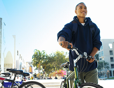 teenager beside a bike