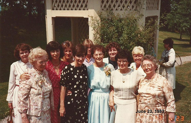 photo of smiling group of members in 1983