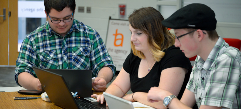 mohawk students working on a project in the agency