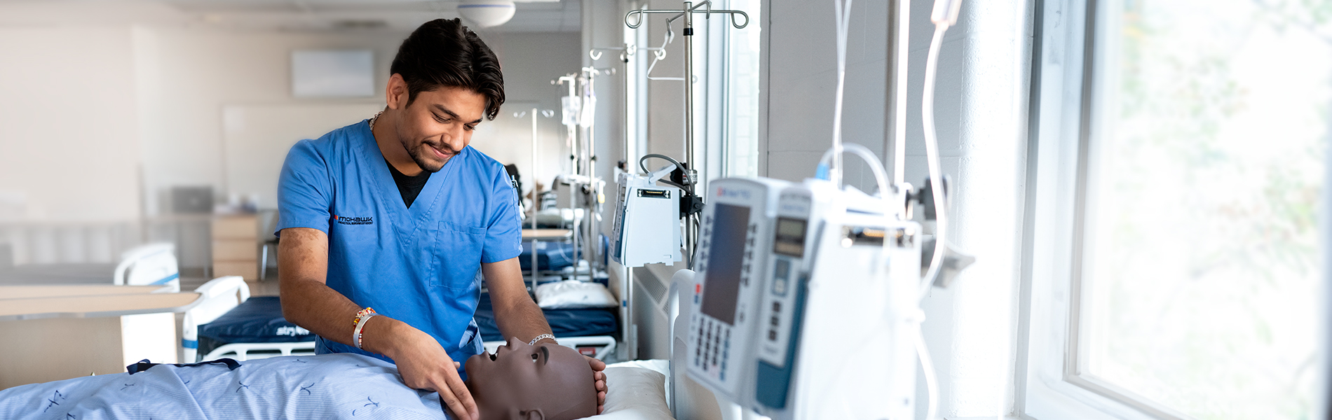 Practical Nursing student, Arshdeep, in a lab.