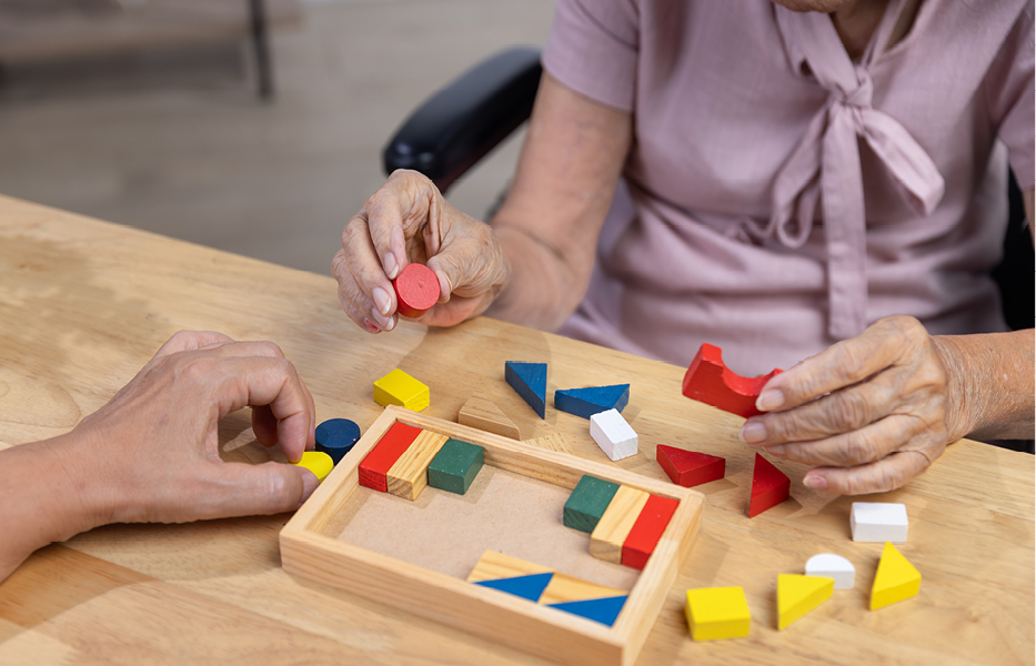 Recreation Therapist doing a block sorting activity with an individual