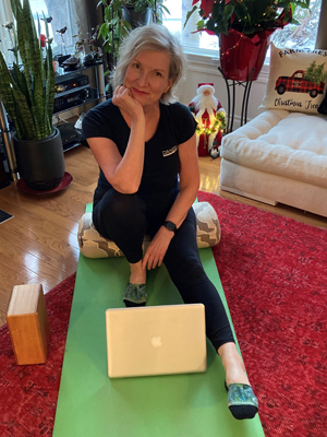 june sitting on the carpet watching exercise tutorials