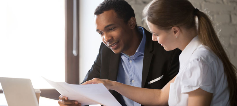 Co-workers examining paperwork