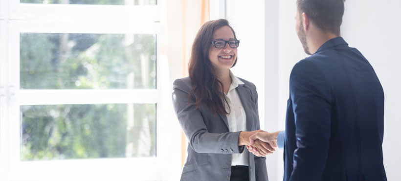 co-op student shaking hands with their employer