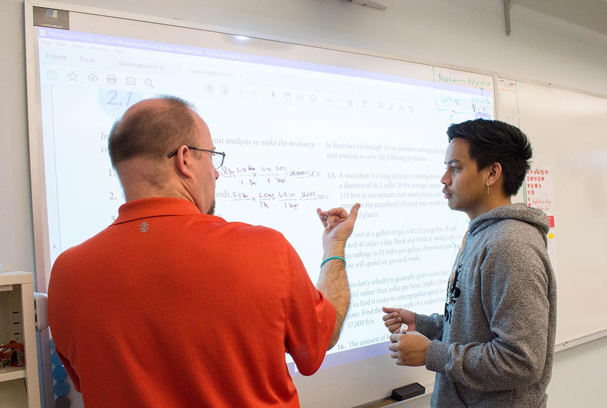 student and instructor communicating with sign language