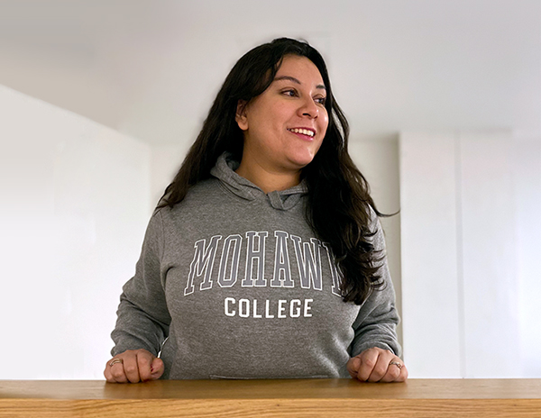 Student wearing a Mohawk College hoodie