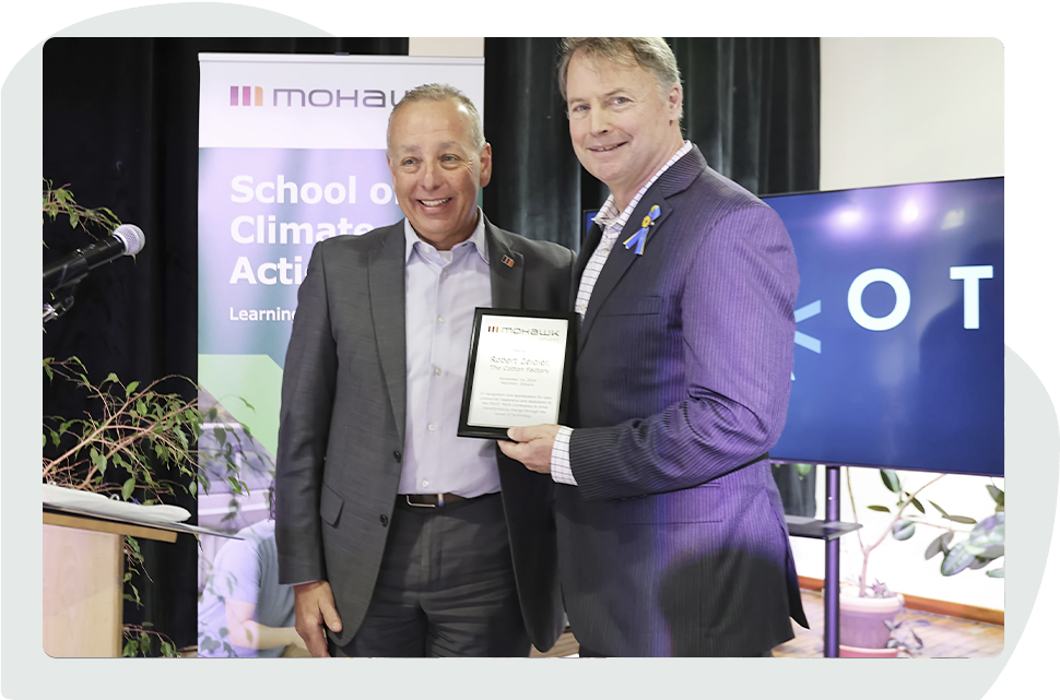 Mohawk College President Paul Armstrong presenting an award at the PIVOT Symposium